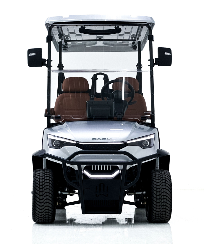 Front view of a silver golf cart with brown seats, black trim, large tires, and a clear canopy, photographed against a white background.